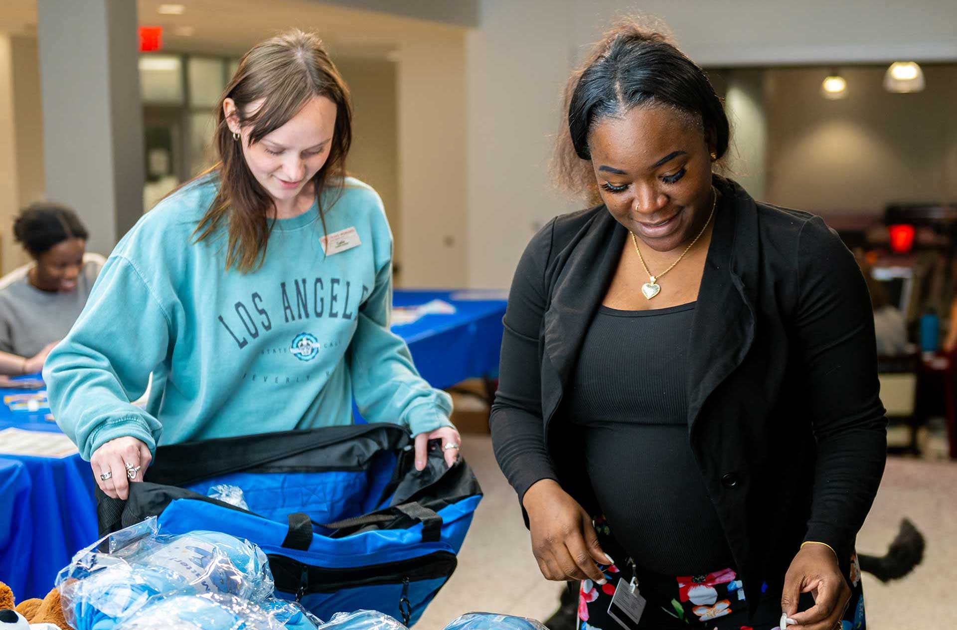 TWU students decorate duffle bags