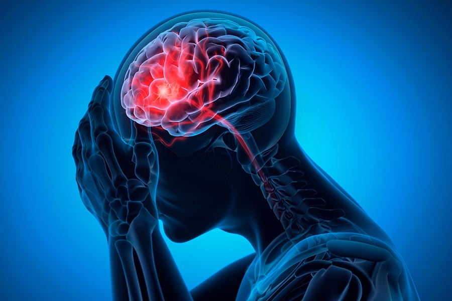 3D image of a man holding his head with his brain lighted up with bright colors