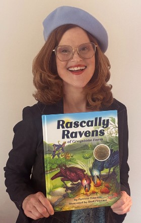 Sheli Petersen holds her book, Rascally Ravens.