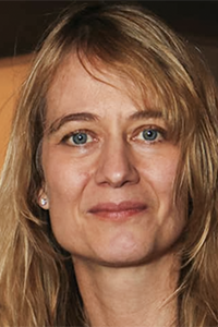 Portrait of Tanya Synar. Woman with blonde hair and blue eyes